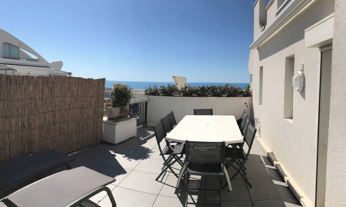 Le Couchant Apartment | Rare Seafront la Grande Motte 4 people large terrace top floor.