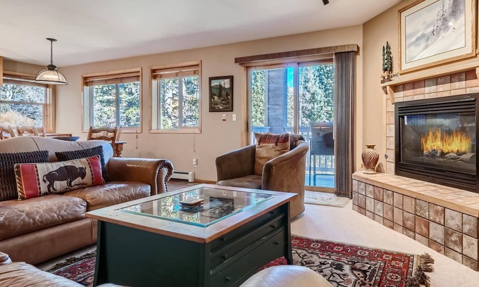 Wildernest Condo | Relax on the Deck with Red Mountain Views. Centrally Located Near Skiing, Trails, Dining & More!