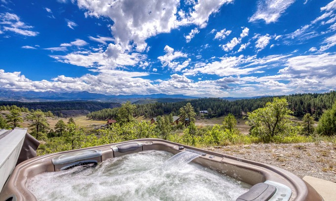 Pagosa Hills House | Retro-Modern, Mountain Retreat with 3 bedrooms, 2 baths, a bonus game room, office, and a beautiful deck with ample seating for enjoying the Stunning Mountain Peak Views. Best Views in town. Permit VRP-25-0317 Maximum Guest: 6