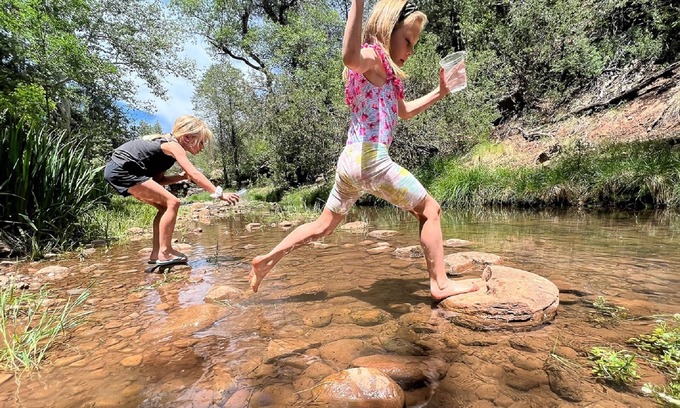 Whispering Pines Cabin | Riverfront Cabin with Hot Tub, Games & Wild Blackberry Trails