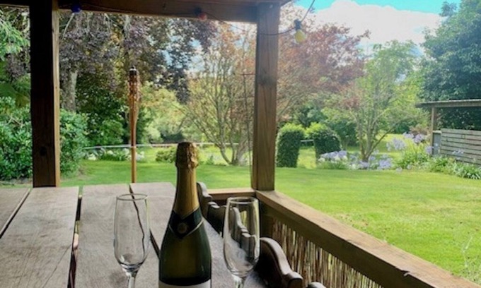 Broadlands Forest House | Riverside accommodation which is perfect for groups. Pizza oven, covered deck.