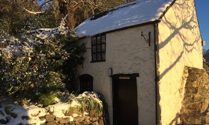 Saint Asaph Cottage | Romantic Stone Cottage with private woodfired hot tub, spa bathroom, yoga deck!