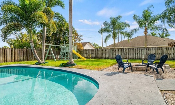 Royal Palm Beach House | Royal Retreat w/ Pool, Grill & Playground!
