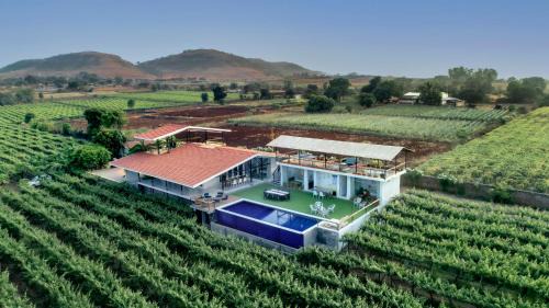 Nashik Villa | SaffronStays Onellaa, Nashik - infinity pool villa surrounded by a vineyard