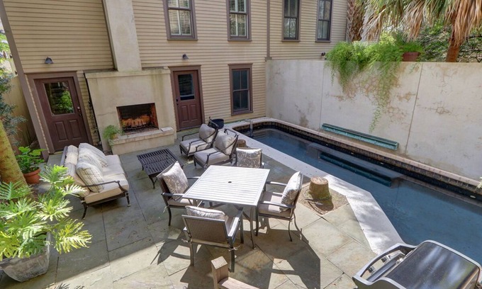 Historic Downtown Savannah Apartment | Saltwater Pool, Outdoor Fireplace & Garage!