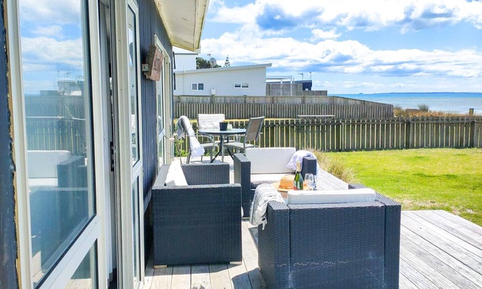 Pukehina House | "Salty Dog Beach Bach" is a comfortable and no-frills beachfront retreat.
