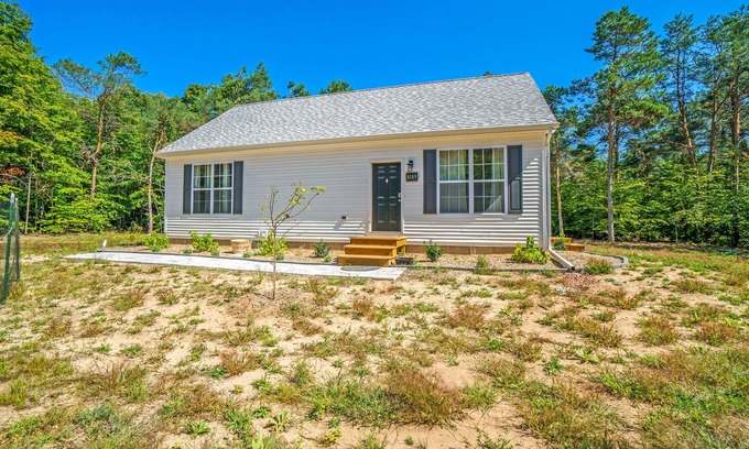 Honor Cottage | Secluded & contemporary cottage with a washer/dryer, central AC, & firepit