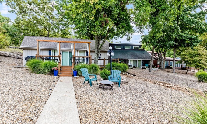 Sunrise Beach Cabin | Secluded lakefront home with private dock, firepit, grill, water views, hammock