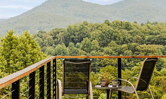 Young Harris Cabin | Serenity Now is a 4BR/3.5BA mountain retreat where fall shines. Gather by the gas fireplace, share meals in open living spaces, and relax on a large deck with sweeping views and changing leaves. Perfect for families, friends, or couples.