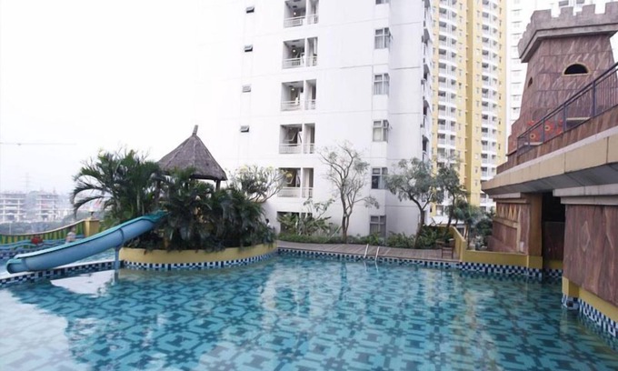 Panunggangan Utara Apartment | Simply Studio Room at Grand Serpong Apartment By Travelio