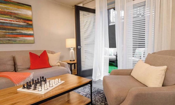 Old East Dallas Condo | Sophisticated 2-bed, 1.5-bath furnished condo in central Dallas featuring a private patio, tranquil garden views, and exclusive access to an award-winning courtyard with spa-inspired wellness amenities, relaxing lounge areas, and resort-style pool.