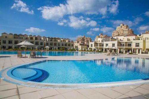Al Hamra Village Villa | Spacious, Cozy Villa with Pool Access