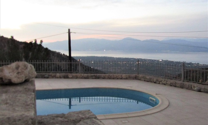 Keryneia House | Stone house with pool and view to the sea