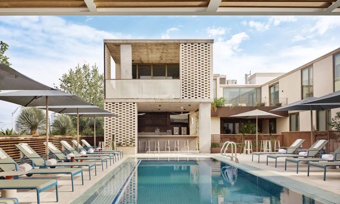 South River City Hotel | Studio-Style Suite with Balcony Overlooking Pool