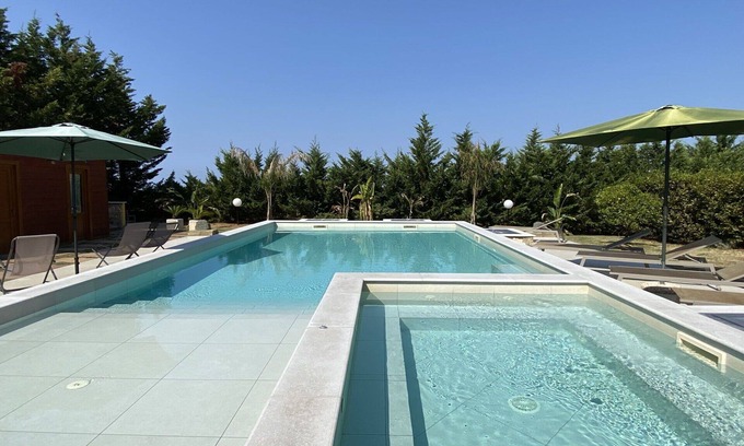 Cecina House | Stunning private villa with A/C, hot tub, private pool, WIFI, TV, patio and pets allowed