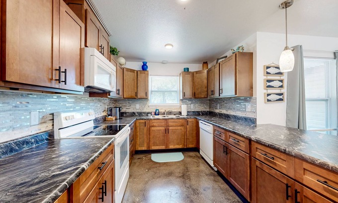 Northeast Pensacola House | Sunny and updated home with workspace, beach gear, games, and firepit