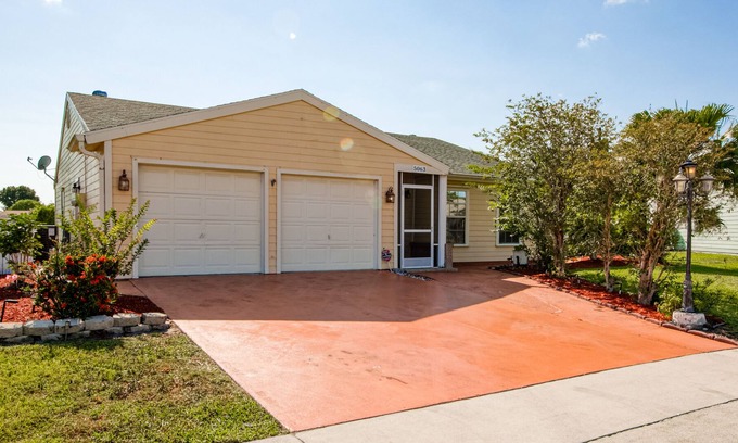 Lake Worth House | Sunny home with private screened pool, spacious patio & fast WiFi