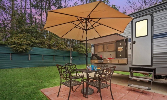 Milton RV Rental | Super- fun camper with plenty of room for a full-size family, lots of comfy beds + full kitchen, bath, and separate bedroom for Mom & Dad. There's even a nice patio with outdoor kitchen and seating area for barbecues, bacon & eggs in the morning, et