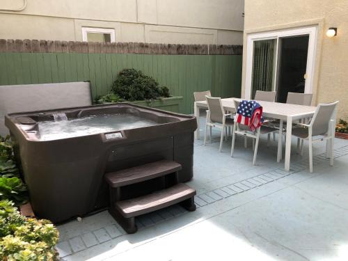 Huntington Beach House | The Americana 4 bedroom with spa and bikes, seps to the beach