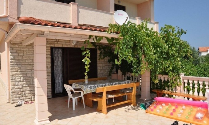 Lopar Apartment | Three bedroom apartment with terrace and sea view Lopar, Rab (A-23747-a)