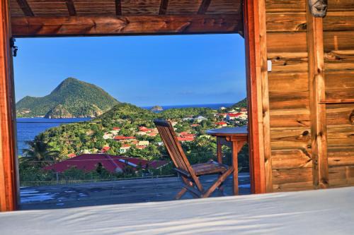Grand Anse House | TI KAZ ANOLI Cottage en bois avec vue sur la baie