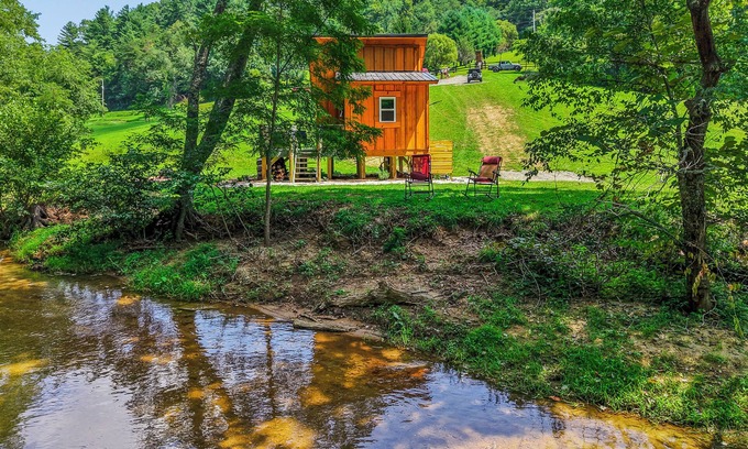 Hillsville Cabin | Tiny cabin sits by a bubbling, stocked creek. Pet friendly for a fee, hot tub
