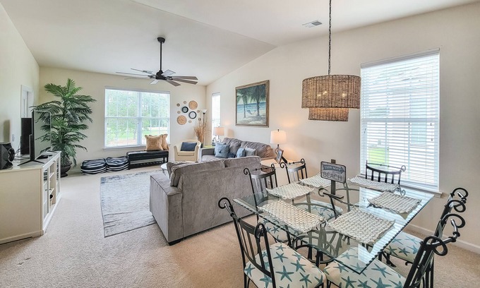 Sunset Beach Condo | Top-floor, end-unit condo with water/golf course views, pools, tennis, & grills