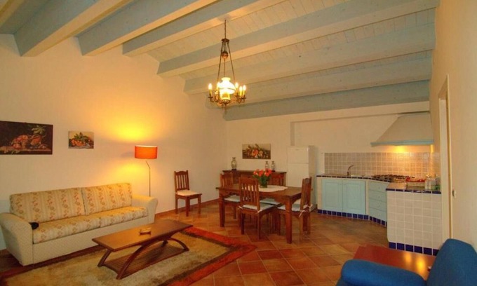 Carruba House | Torre Archirafi Resort -refuge nestled in the green Sicilian countryside.