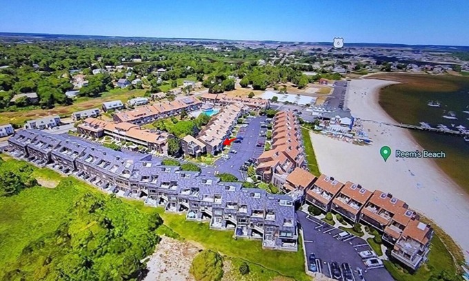 Hyannis House | Townhouse less than one-minute walk to a private beach and heated pool on site