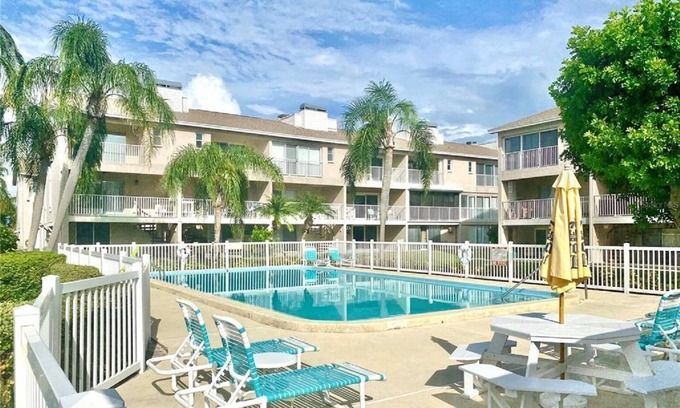 Capri Isle House | Treasure Island St Pete Beach FL 2BR 4BA Walk to Beach 3 level Garage Townhouse