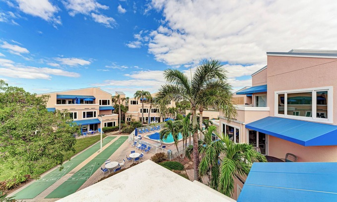 Whitney Beach Condo | Unit #313 Sand Cay Beach Resort Pool and Garden