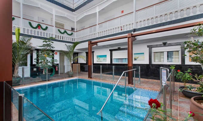 Playa de Arinaga Apartment | Vacation 'Casa Paula - 22' with Mountain View, Shared Pool and Wi-Fi