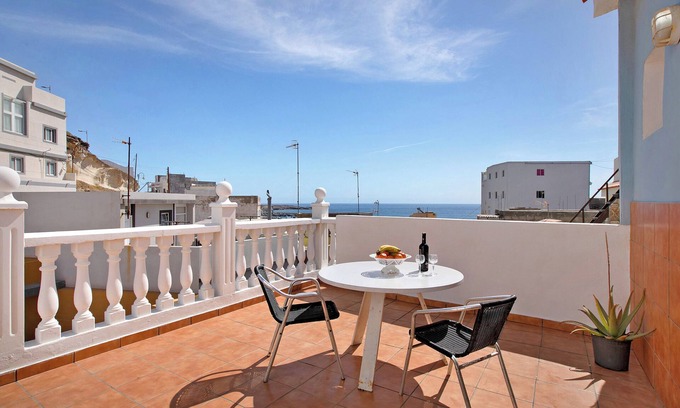 Las Arenas Apartment | Vacation Home "Atico Las Arenas" with Sea View, Private Terrace & Wi-Fi