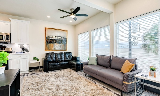 Bacliff House | Vibrant orange retreat with an enclosed yard, grill, and ocean views - dogs ok