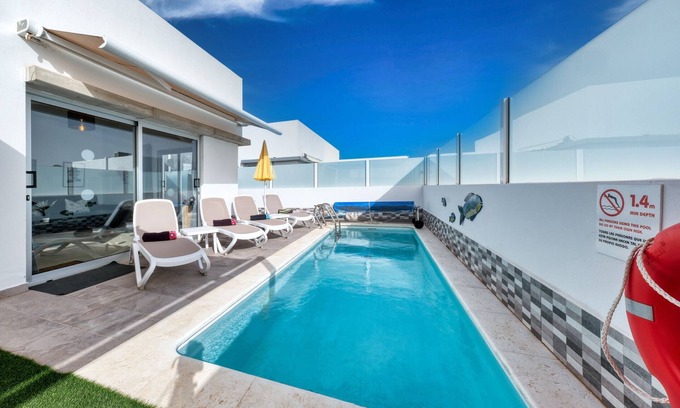 Playa Blanca Ski Chalet | Villa Cassia - Private Pool, Foosball, BBQ, Air-Con and SAT Tv By Lanzarote Vacation Homes
