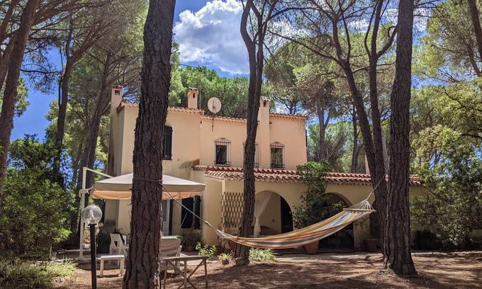 Santa Margherita di Pula Villa | Villa in a pine forest with large private garden, 400 m from the beach.