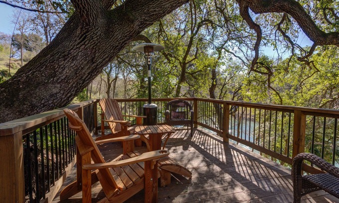 Gruene House | Walk to Gruene Private access to Guadalupe River Cascading Decks in the trees