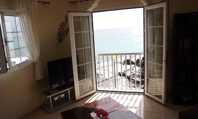 Punta Mujeres Apartment | Waterfront Apartment with roof Terrace. Children free in summer.