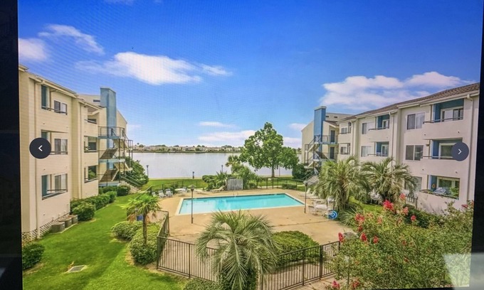 Slidell Condo | Waterfront, Amazing sunset overlooking pool.