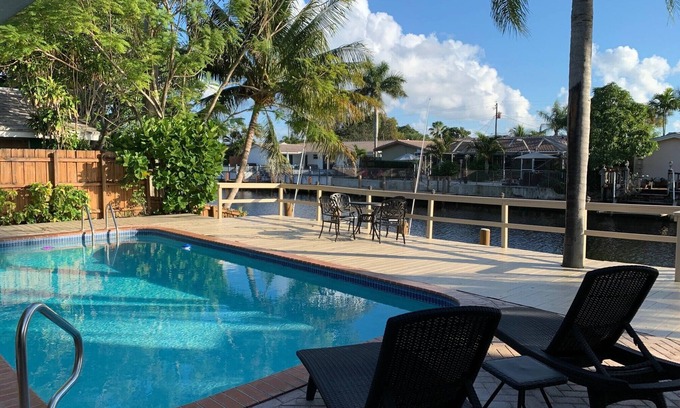 Coral Ridge Isles House | Waterfront Home with a Heated Pool 10 min to the Beach