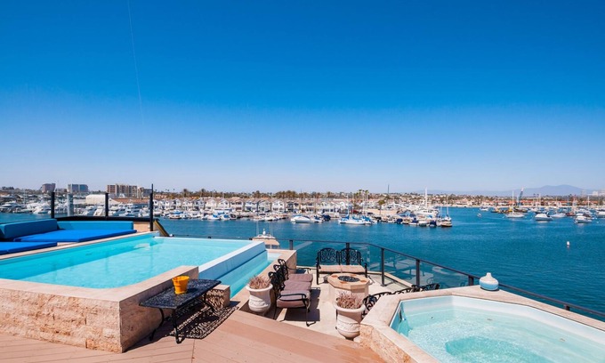 Balboa Peninsula House | Waterfront Mansion w. Rooftop pool and hot tub. Amazing bay & beach views