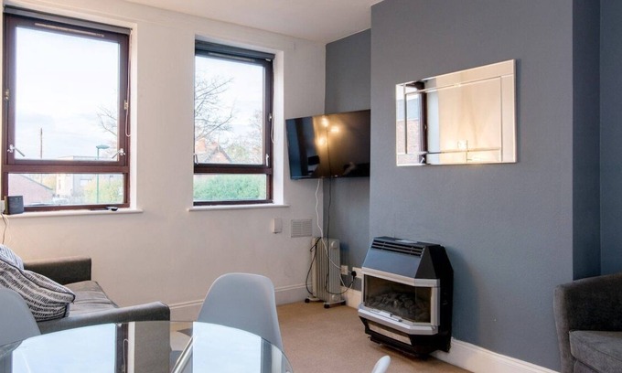 Woodthorpe Apartment | You’ll love putting your feet up in the lounge area, complete with Smart TV and snug sofa space