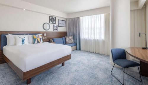 Corner Queen Room with Sofa Bed