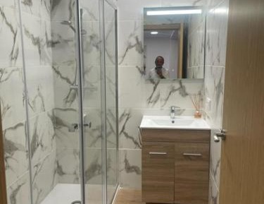 One-Bedroom Apartment with Balcony and City View