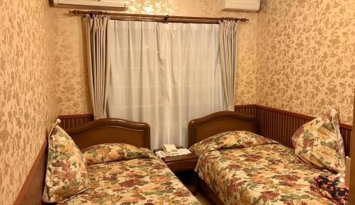 Twin Room with Private Bathroom - Non-Smoking