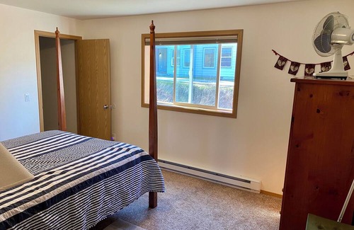 Juneau Apartment | Sunny apartment near a lake, great walking trails, and a playground on site.