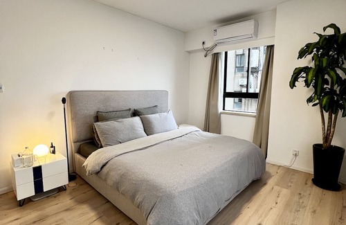 Huaihai Road Commercial Area Apartment | peaceful urban retreat in a stylish minimal apartment with views across the city
