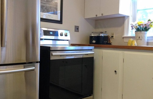 Pawtuxet Village Historic District House | A Curated Cape on the Cove....walk to shops and restaurants in seaside village.