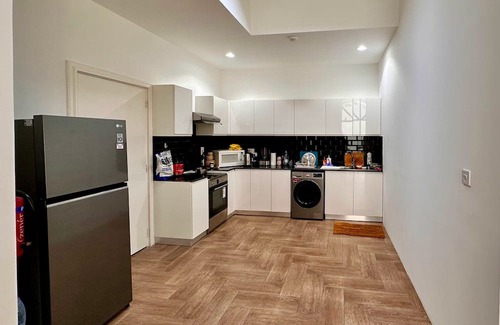 Doha Apartment | Heart of Doha Elegant Home with Shared Swimming Pool