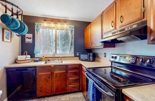 Greenville Junction Condo | First-floor condo near lake/skiing/hiking with beach access, lake view & patio